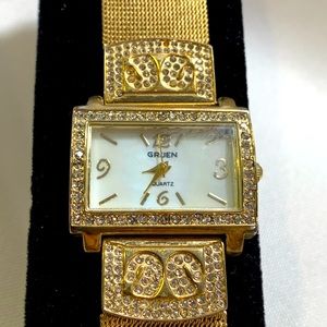Gold metal band, with quarts/gold,crystal setting, watch